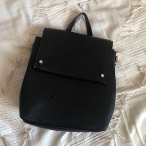 A new day small black brand new backpack
